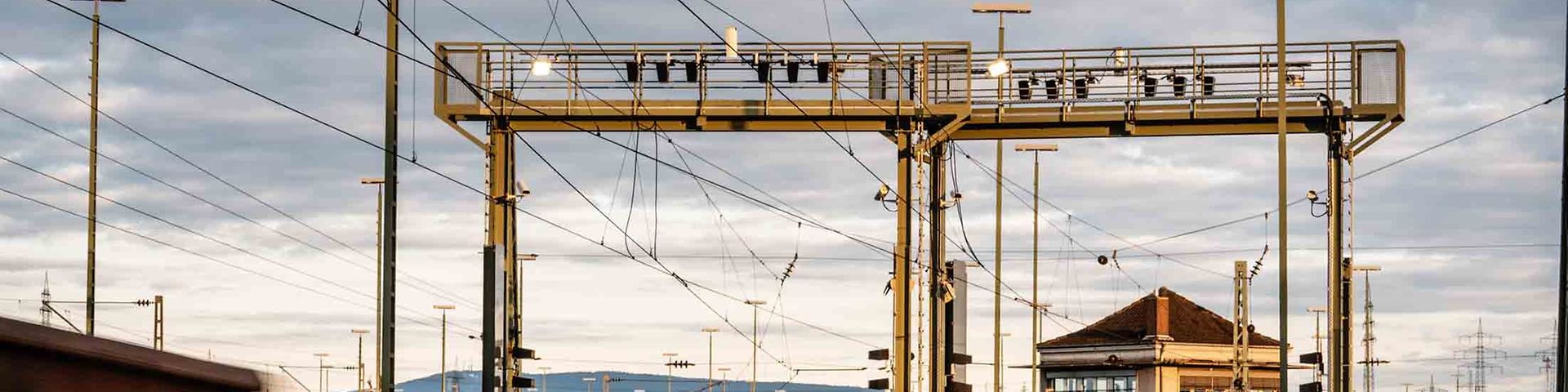 A freight car drives under a camera bridge with artificial intelligence for an inspection.