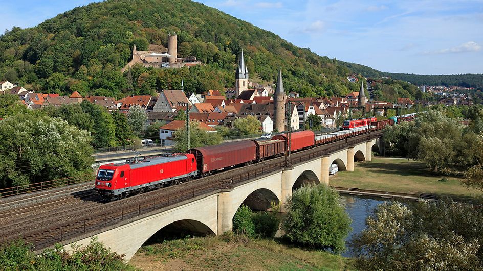 Freight train drives across a bridge