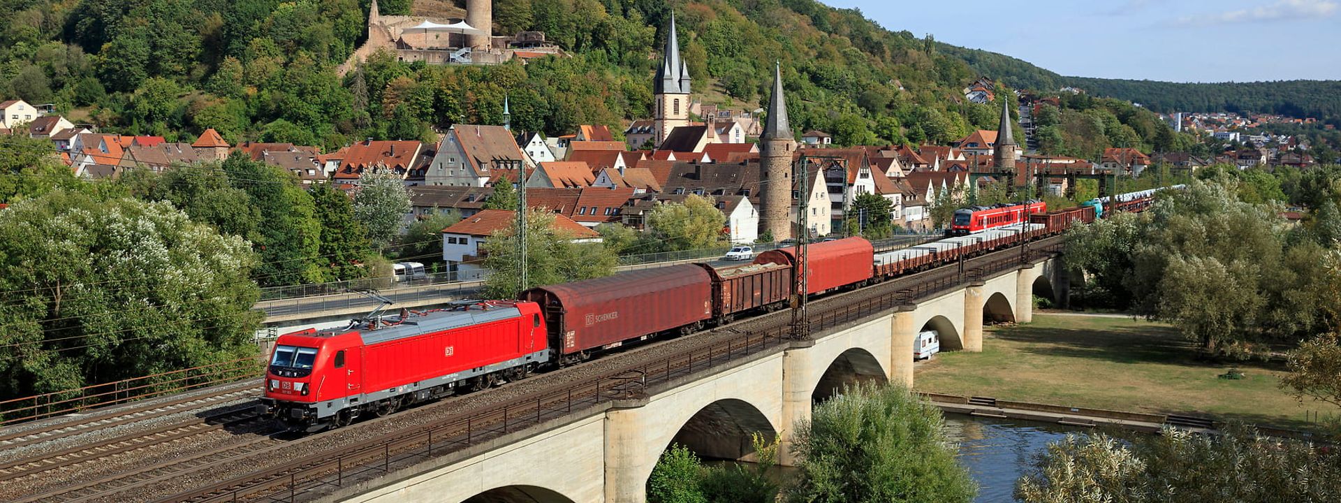 Freight train drives across a bridge