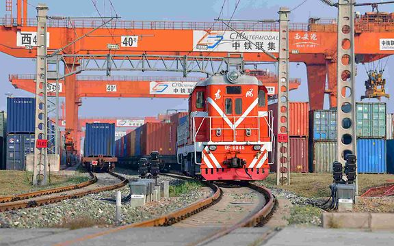 A Chinese train pulls out of a terminal.