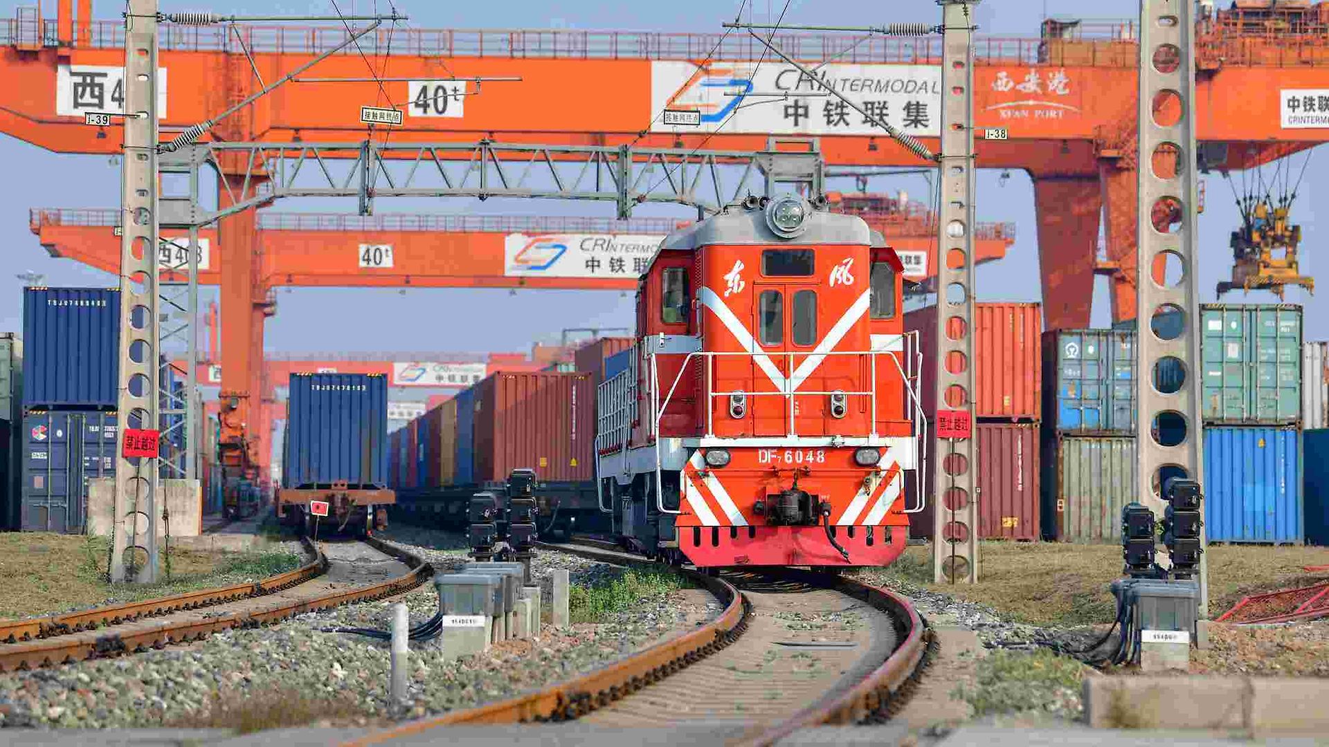 A Chinese train pulls out of a terminal.