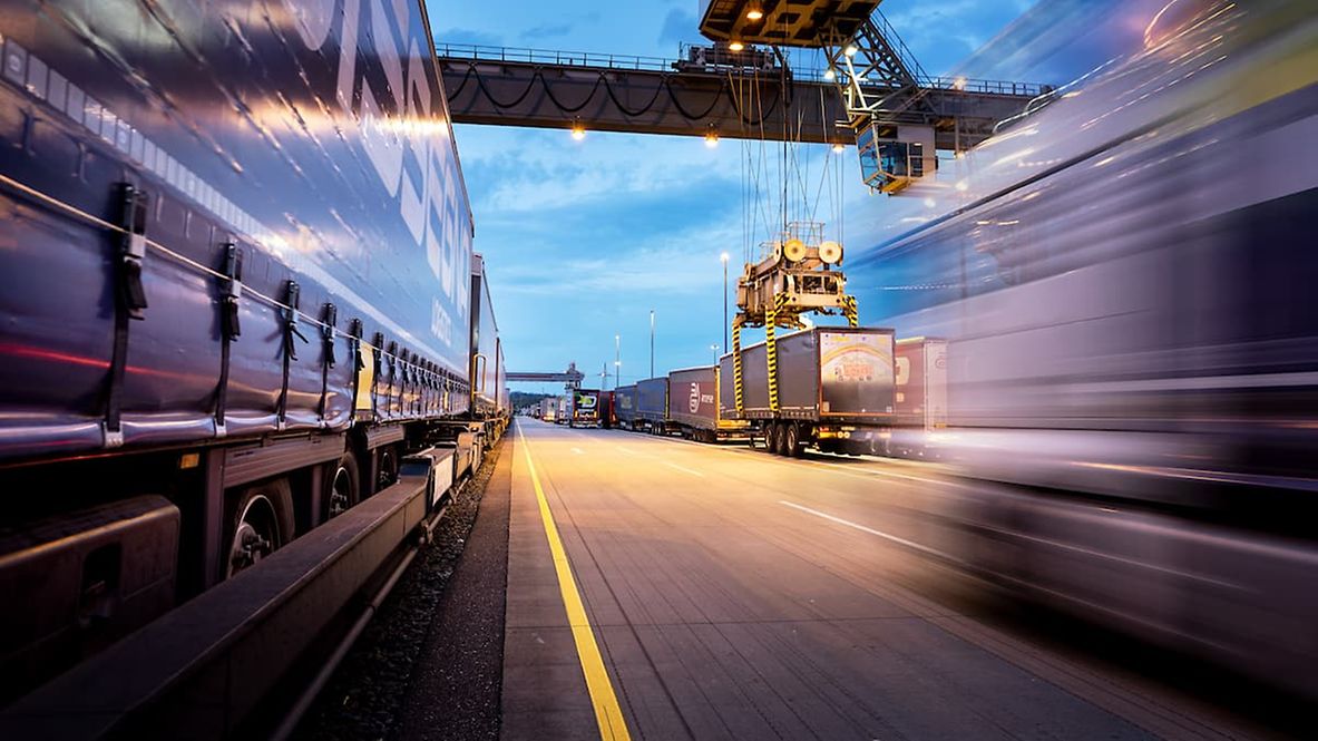 A transhipment crane loads a megatrailer onto a train