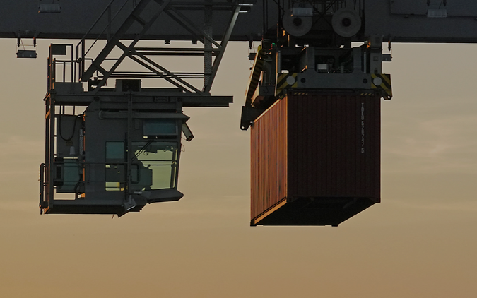 A container hangs on a crane