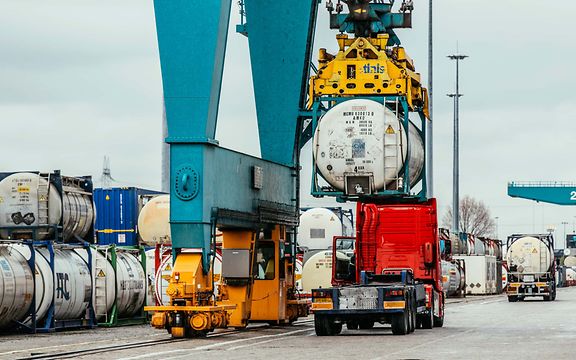 Tank containers are transferred from rail to lorry for the last mile.