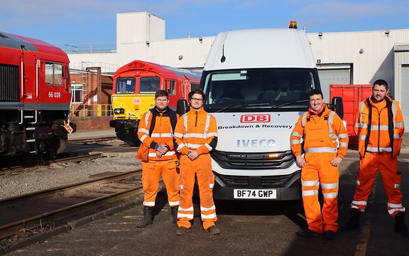 The breakdown and recovery team stands in front of one of the new vehicles.