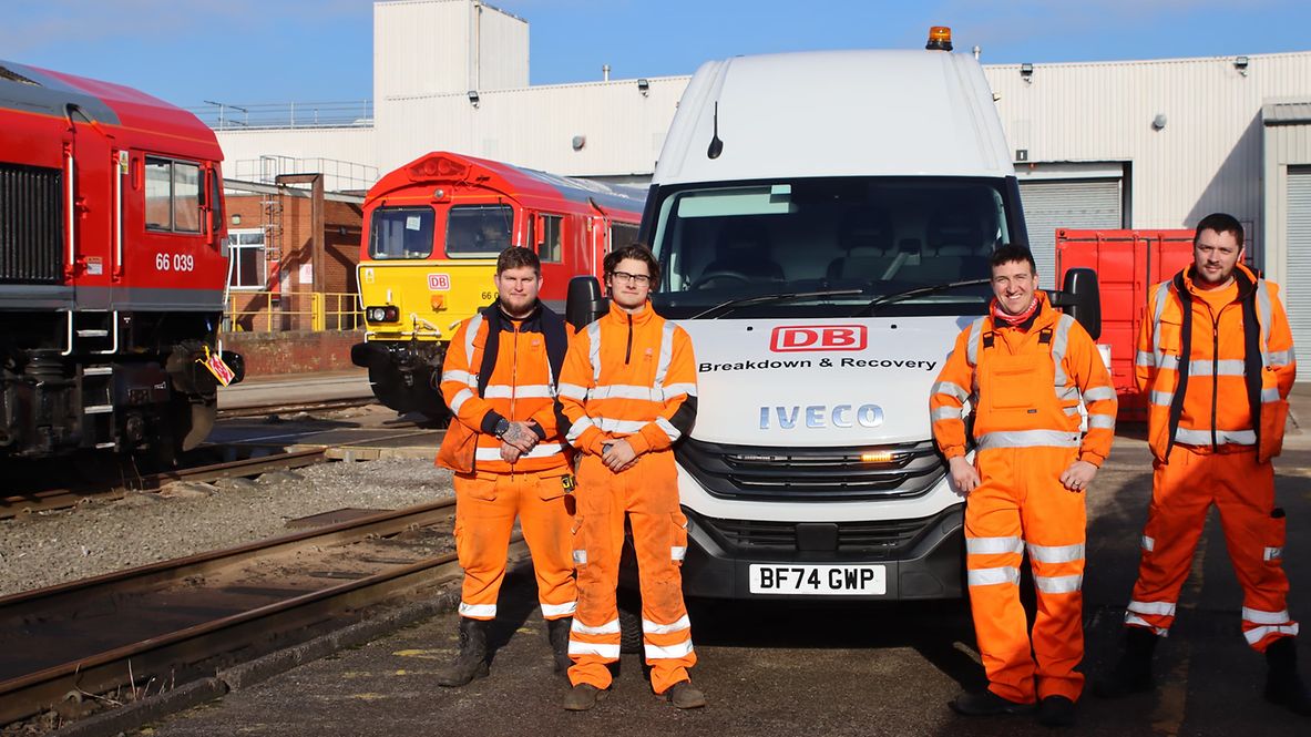 The breakdown and recovery team stands in front of one of the new vehicles.