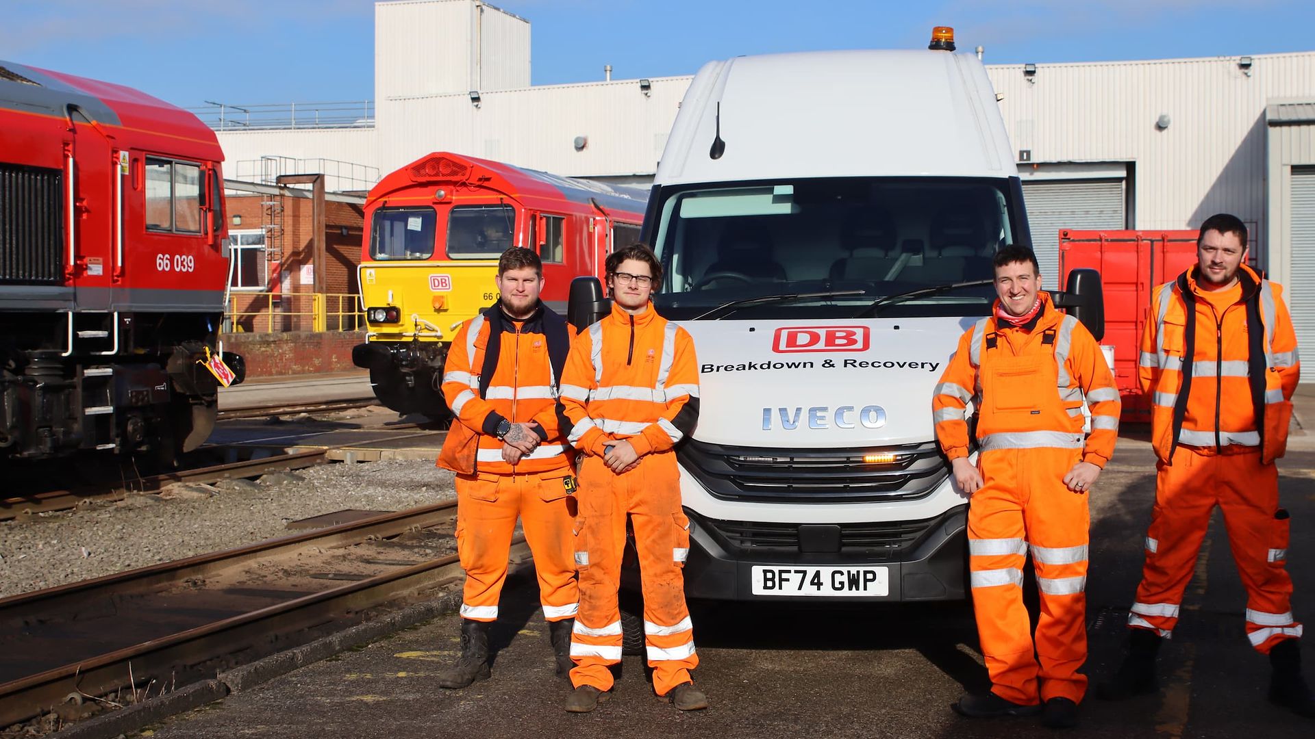 The breakdown and recovery team stands in front of one of the new vehicles.