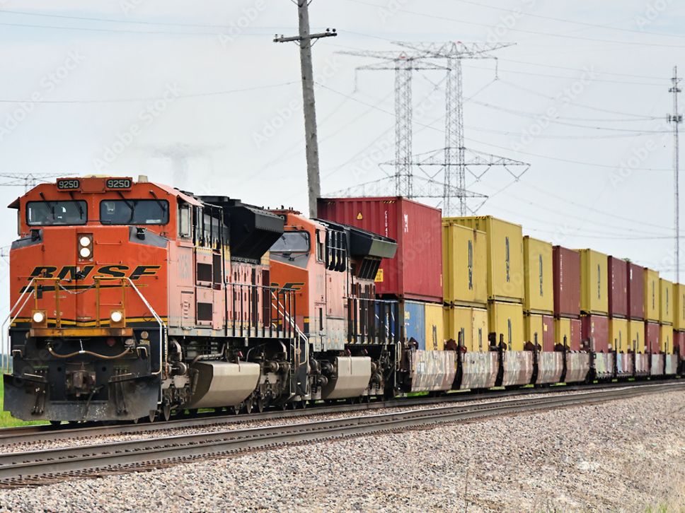 A Burlington Northern Santa Fe double-stack container train is travelling through Illinois