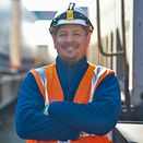 Employee in front of train