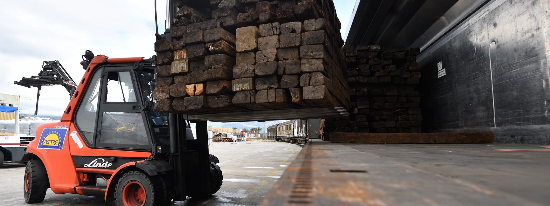 Forklift carrying a load of wood