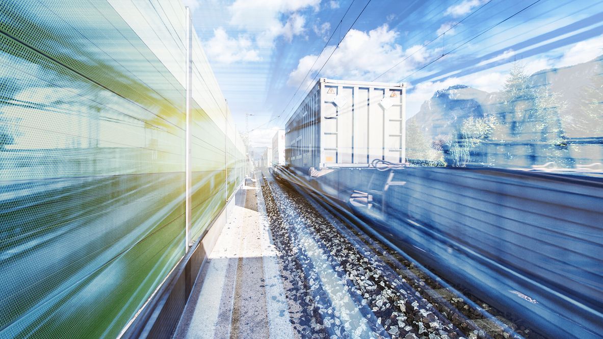 Photomontage with truck next to rails.