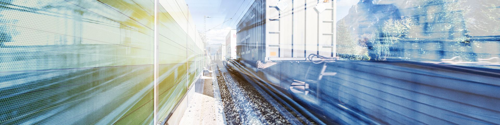 Photomontage with truck next to rails.