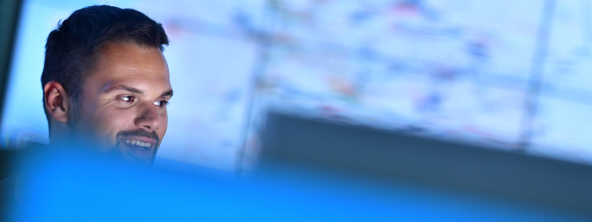 Office worker in front of screen